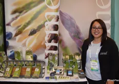 Lulu Vasquez with Gourmet Trading Company proudly shows asparagus and blueberries.
